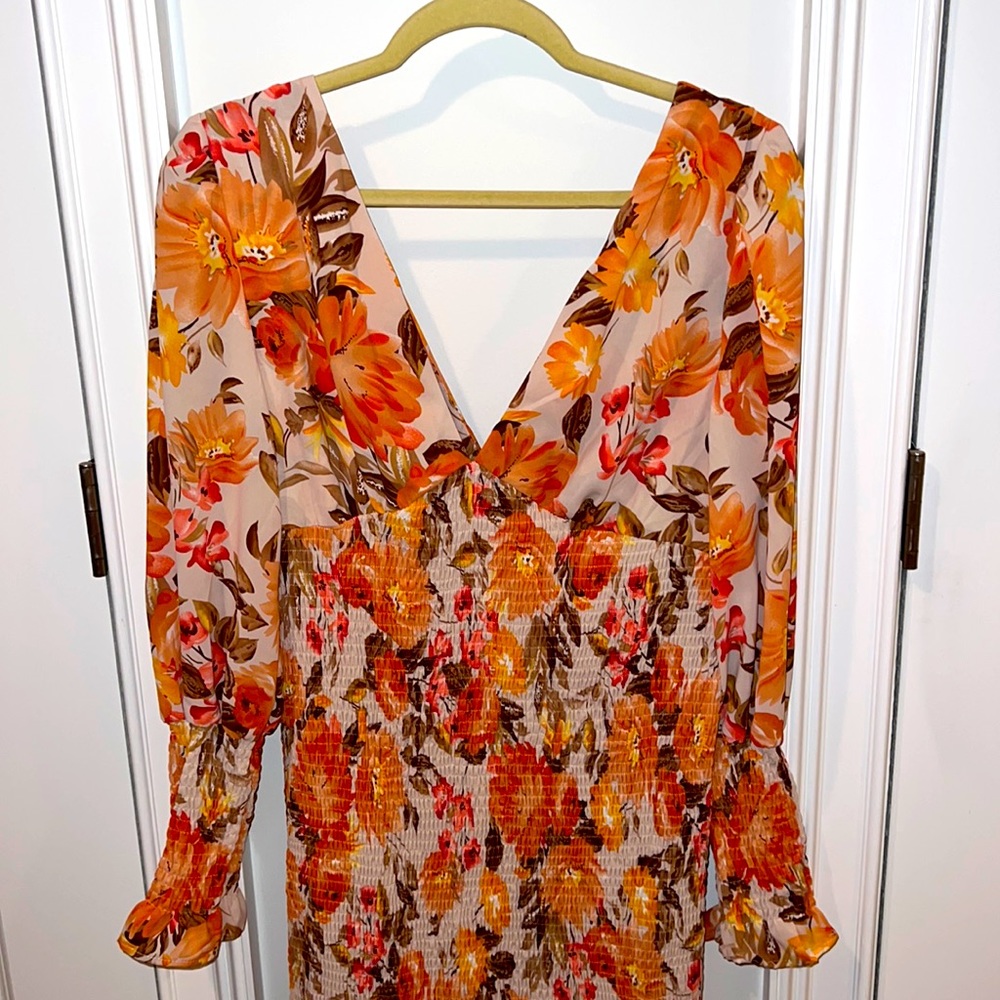 Beautiful floral long sleeved v neck dress